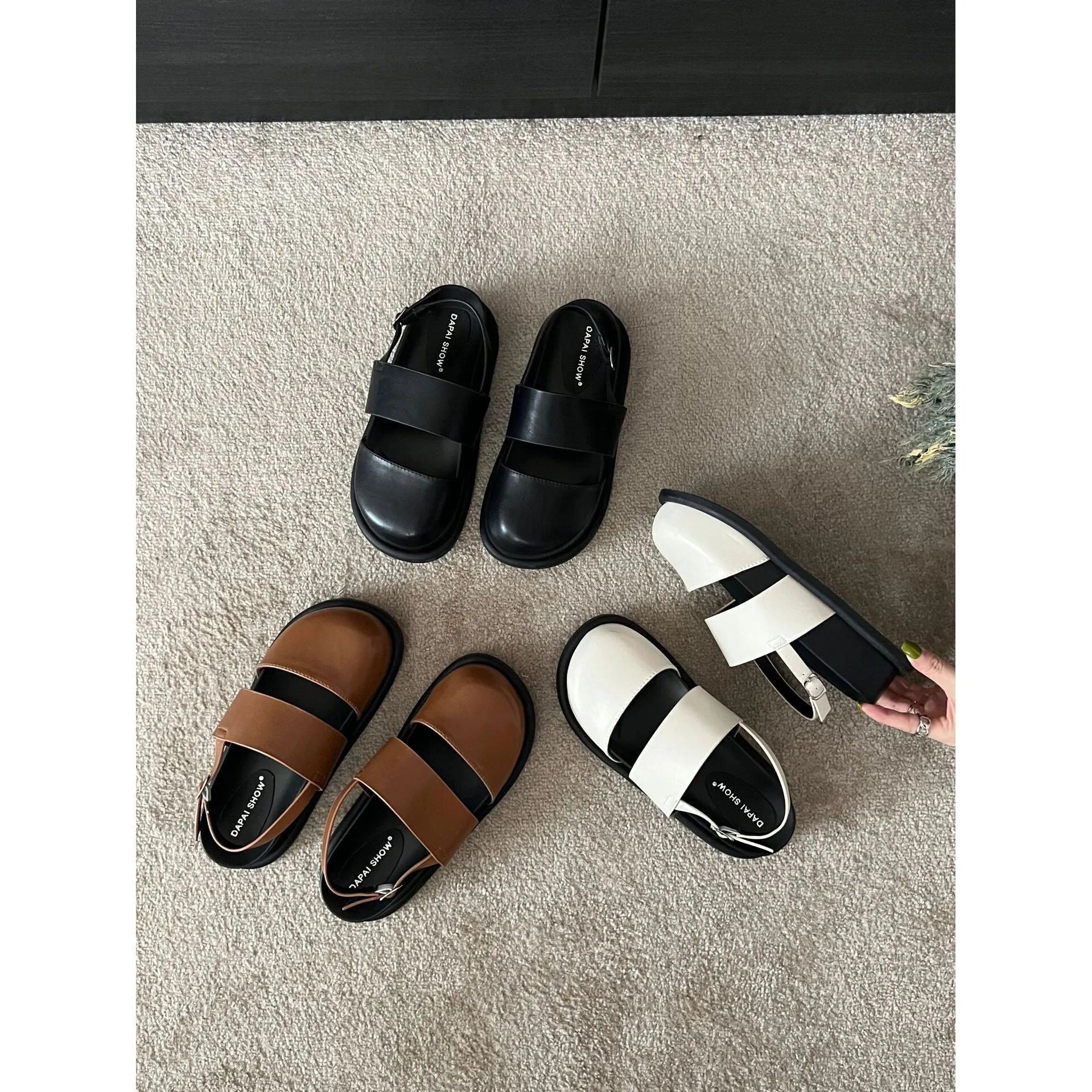 Korean style closed toe sandals with an ankle strap buckle in black, brown, and apricot colours.