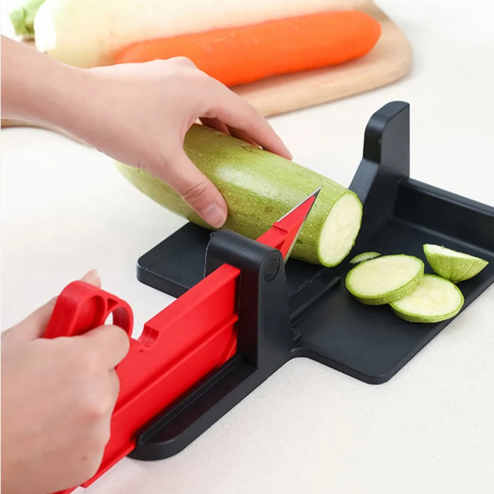 Green and red vegetable cutter with stainless steel blades for slicing carrots and potatoes