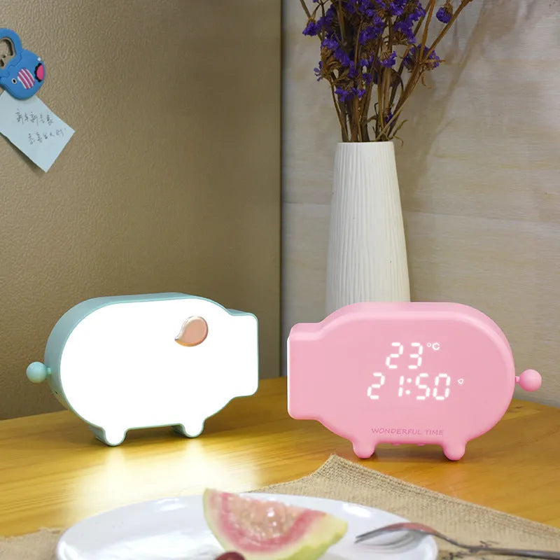 Blue LED digital alarm clock showing time and temperature with USB charging port