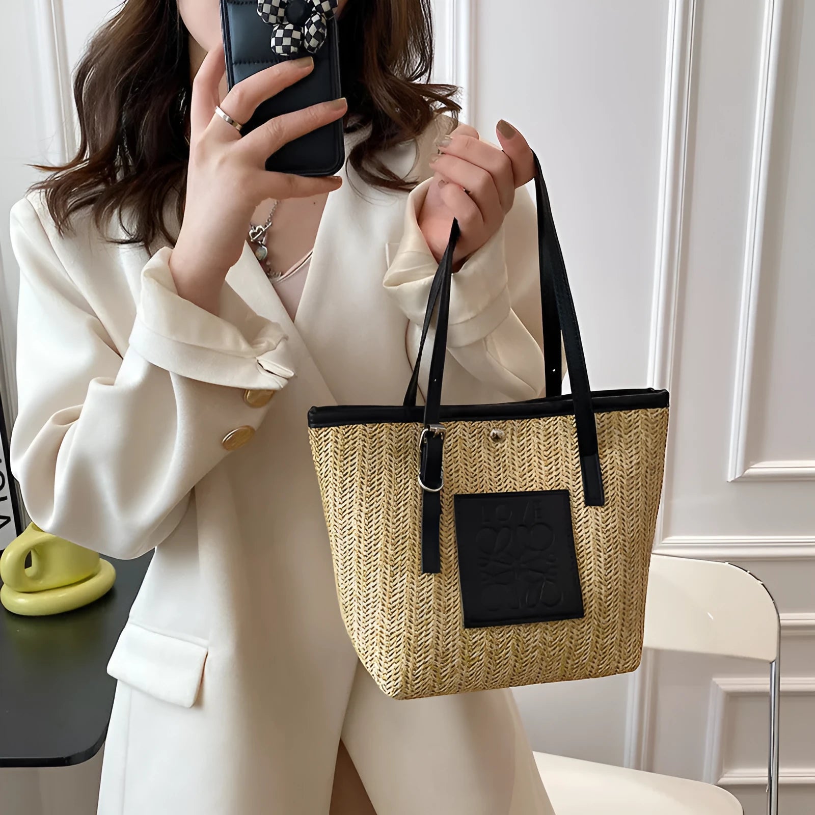 Straw woven women's shoulder bag with retro design showing three-dimensional pockets and 18cm handle