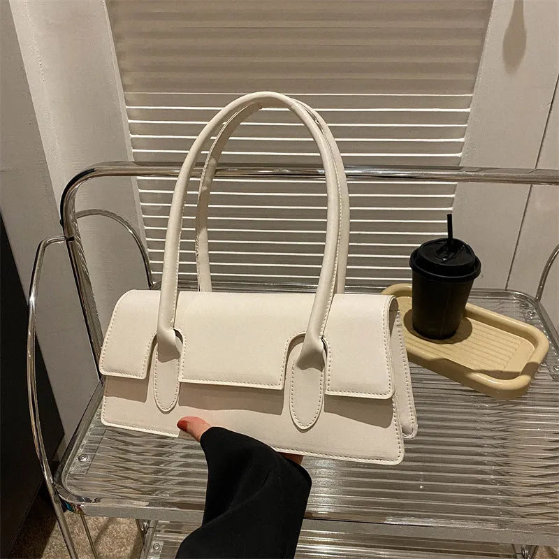 Women's retro square PU shoulder bag with stitching details and sandwich pocket exterior