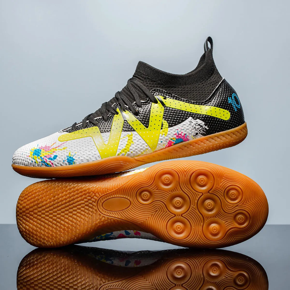 Adult low-top football boots in Black and Yellow colour with mesh lining and rubber sole.