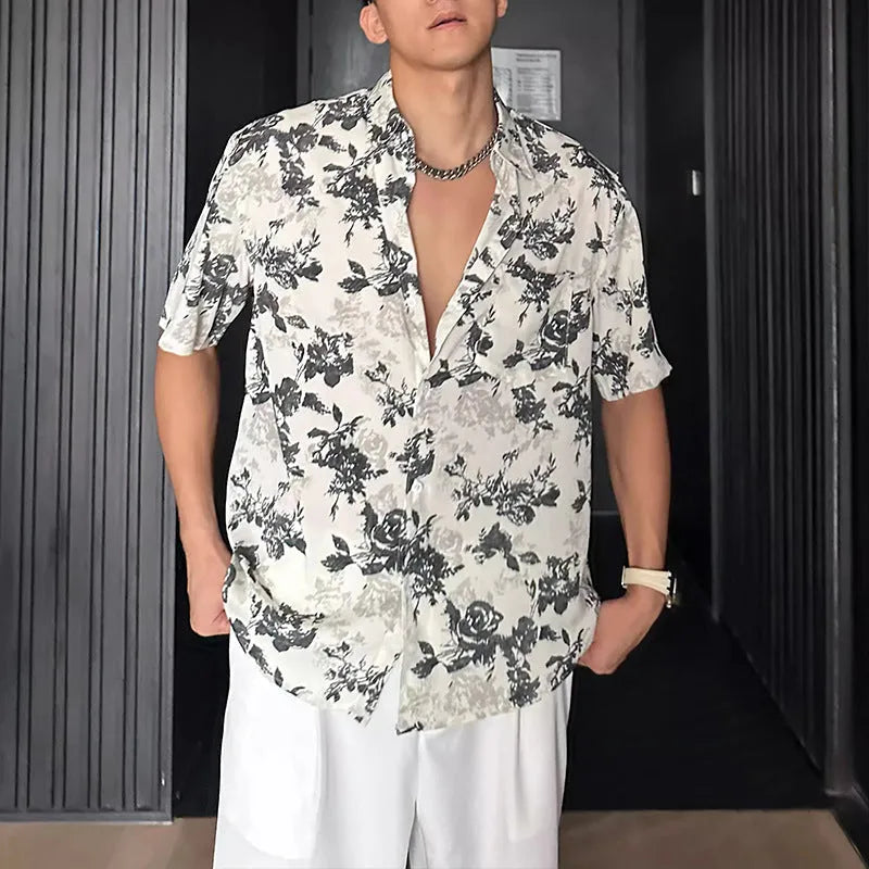 Men's loose black floral print short sleeve casual shirt on a hanger