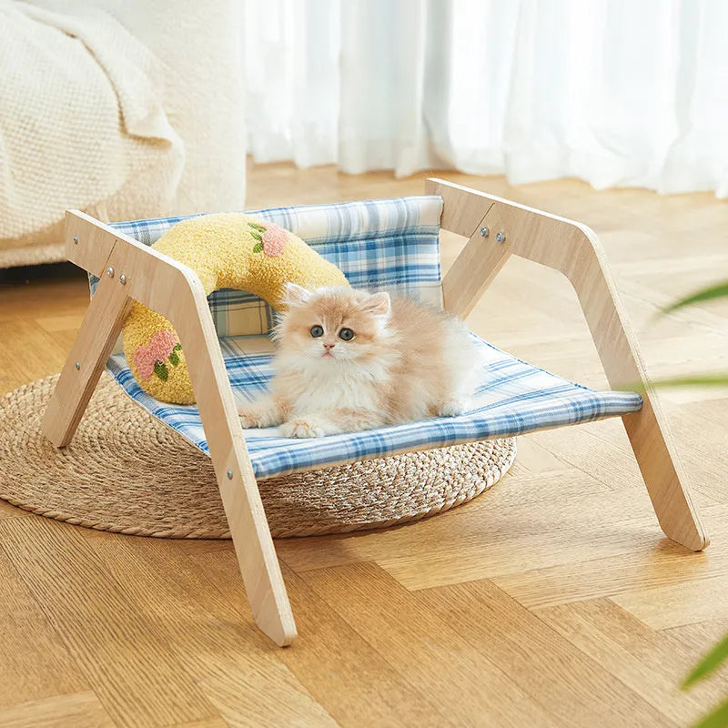 Wooden cat hammock bed with elevated design and cloth sleeping surface in blue colour
