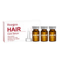 Three small bottles of nourishing hair root liquid treatment with botanical oils on a white background.