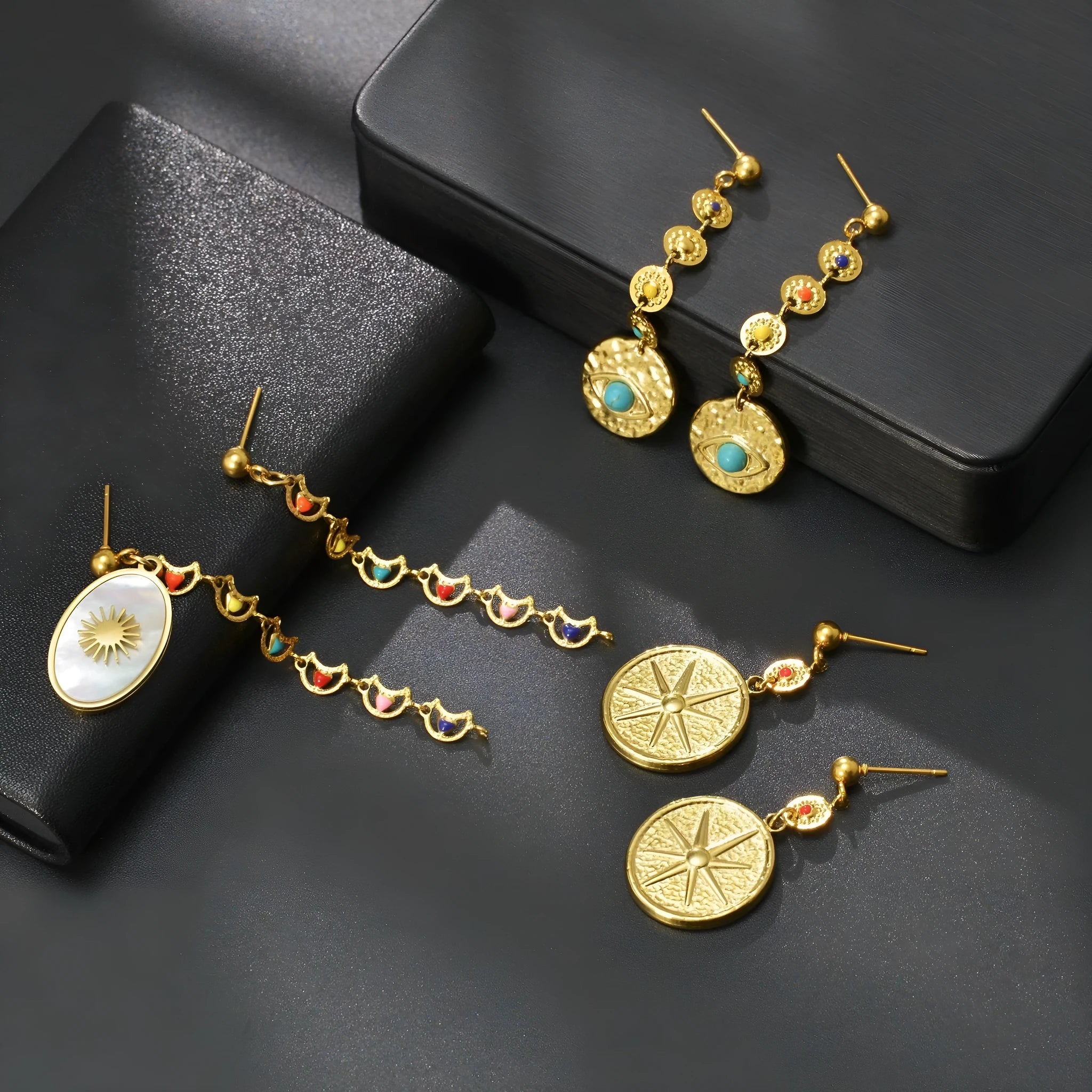 Stainless steel geometric personality earrings showing Eight Awn Star, Eye, and Shell Sun designs.