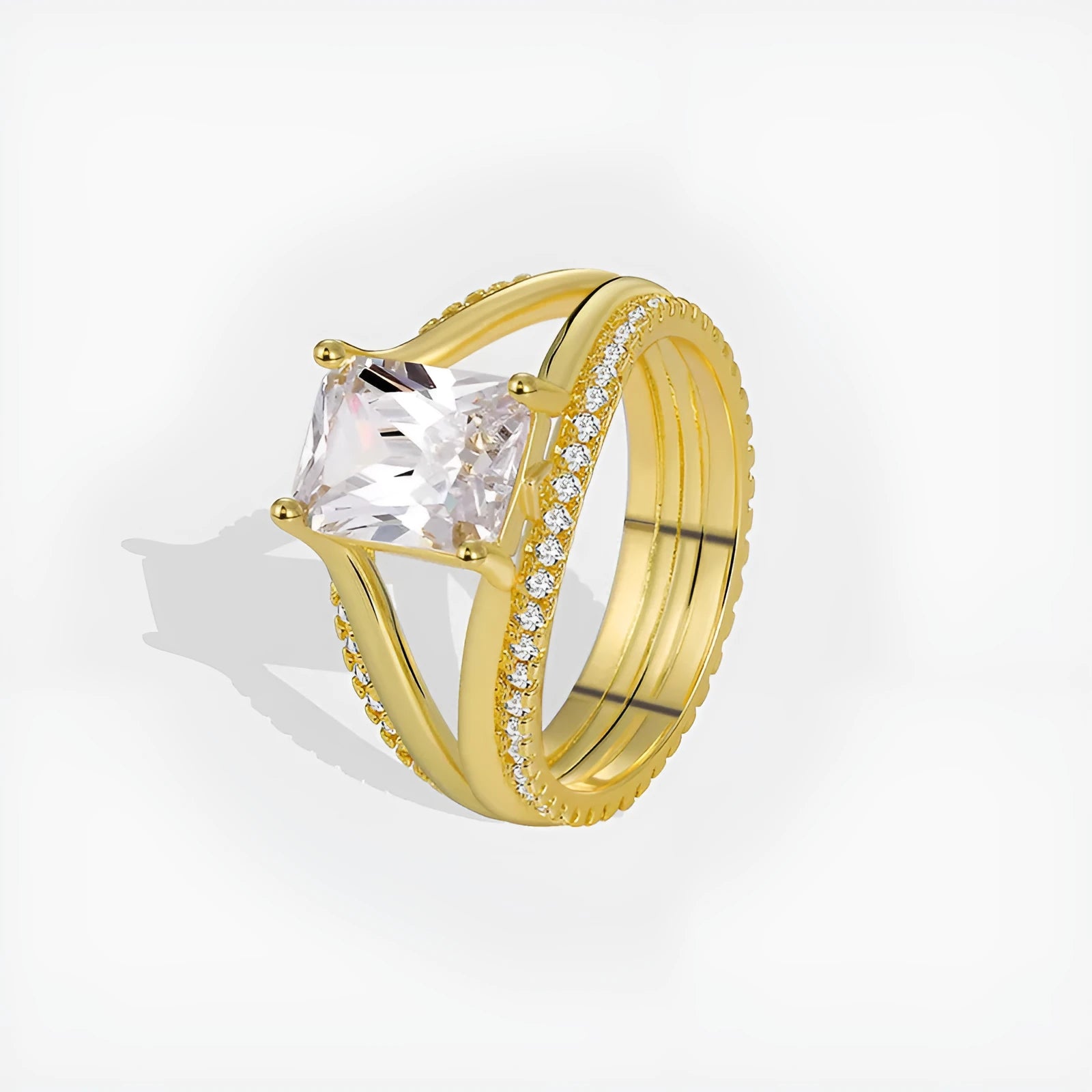 Geometric gold electroplated copper ring for women with a square zircon, shown in sizes 6 to 9.