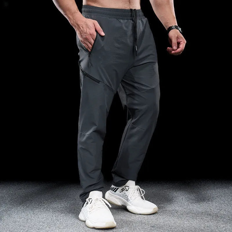 Men's waterproof quick-dry exercise pants in nylon fabric for sports and fitness activities