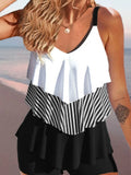 Women's backless ruffle-trim bikini swimsuit with spaghetti straps and high-cut briefs in floral pattern.