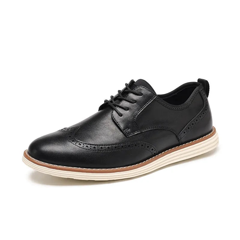 Men's black slip-on business casual shoe with round toe and carved PU upper detail on a TPR sole.