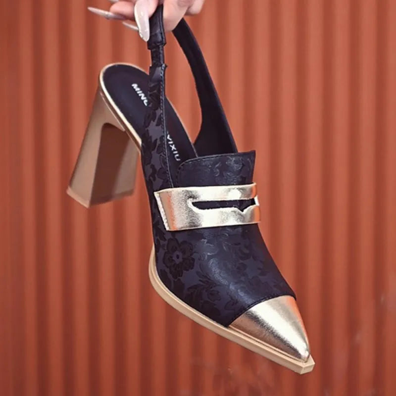 Women's black strapped sandals with a chunky block heel and pointed toe design on a white background.