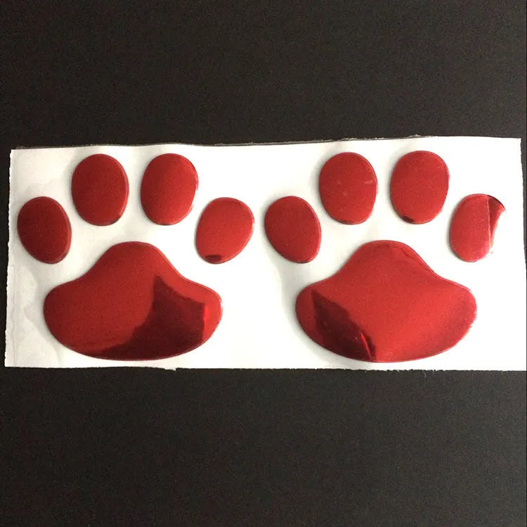 PVC hand-shaped brush dog footprint car sticker on a vehicle bumper in black colour.