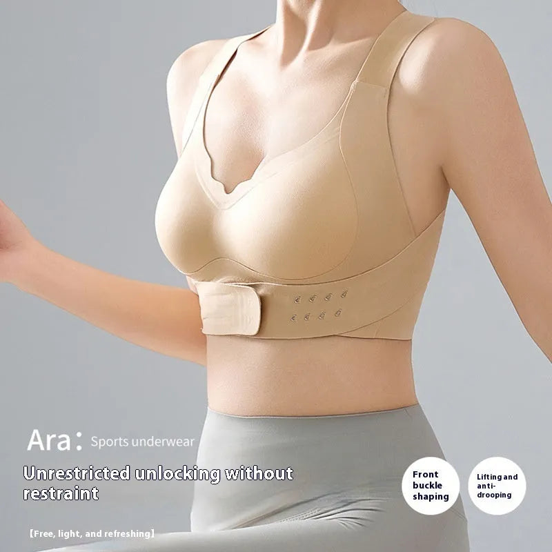 Women's black sports bra with front buckle closure and back shaping, shown on a size mannequin.
