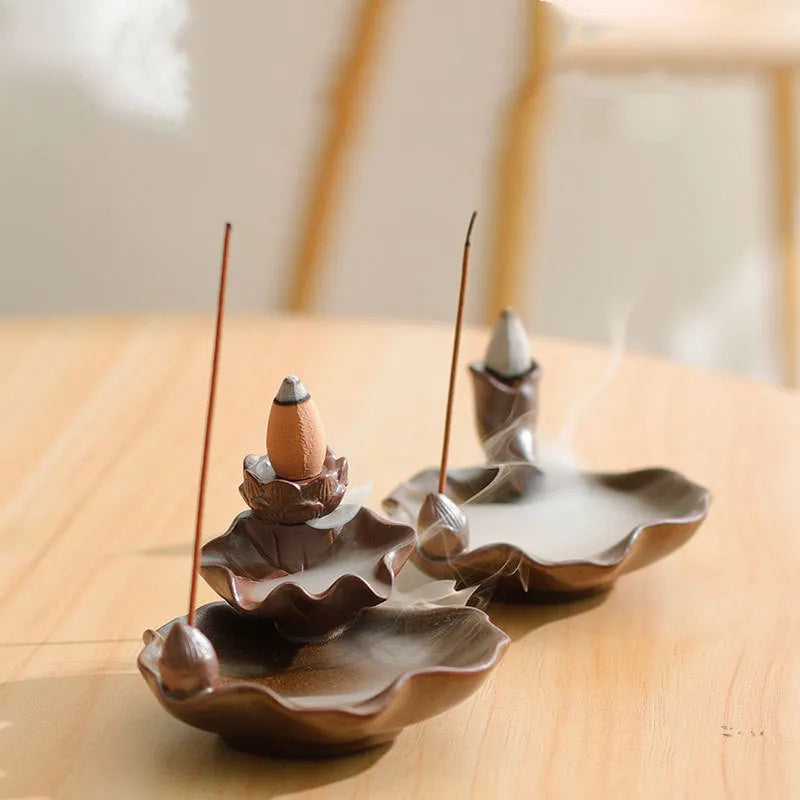 Ceramic reverse flow incense burner in purple clay with Ge kiln finish and lotus or plum blossom design