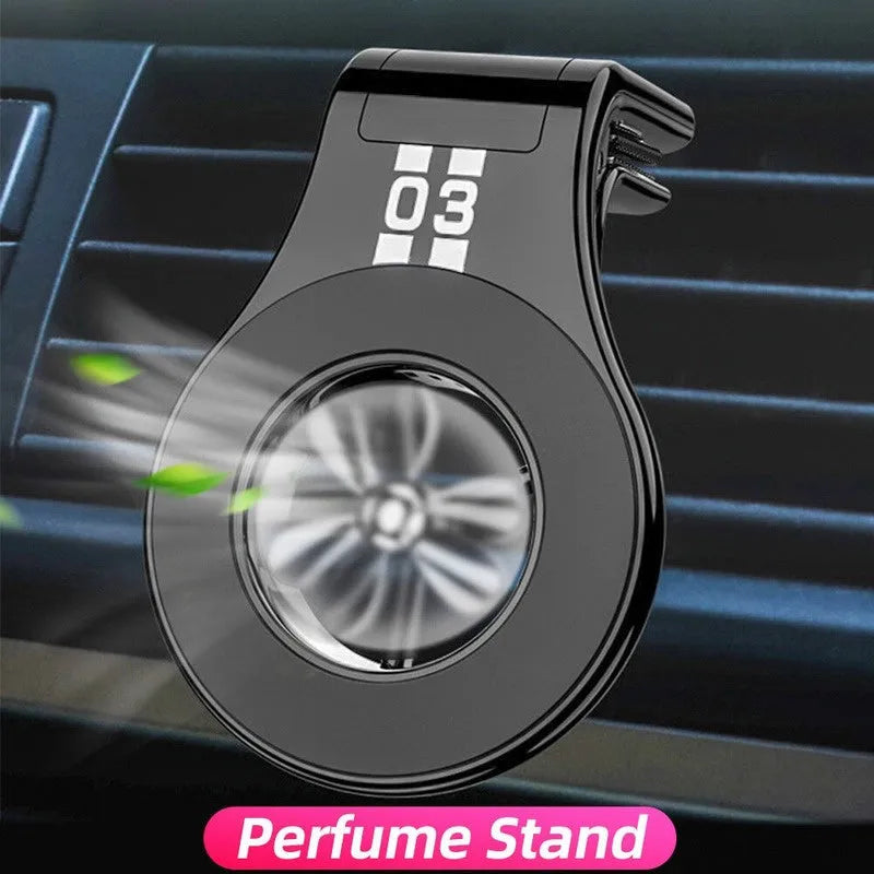 Black magnetic car air vent phone holder with adjustable mount and fragrance slice compartment.