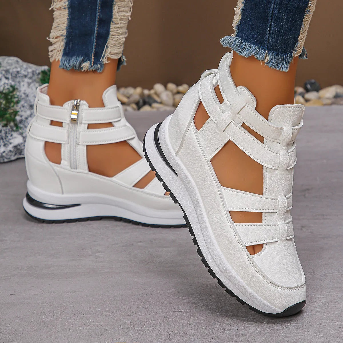 Women's black platform sandals with hollow-out design and Velcro strap.