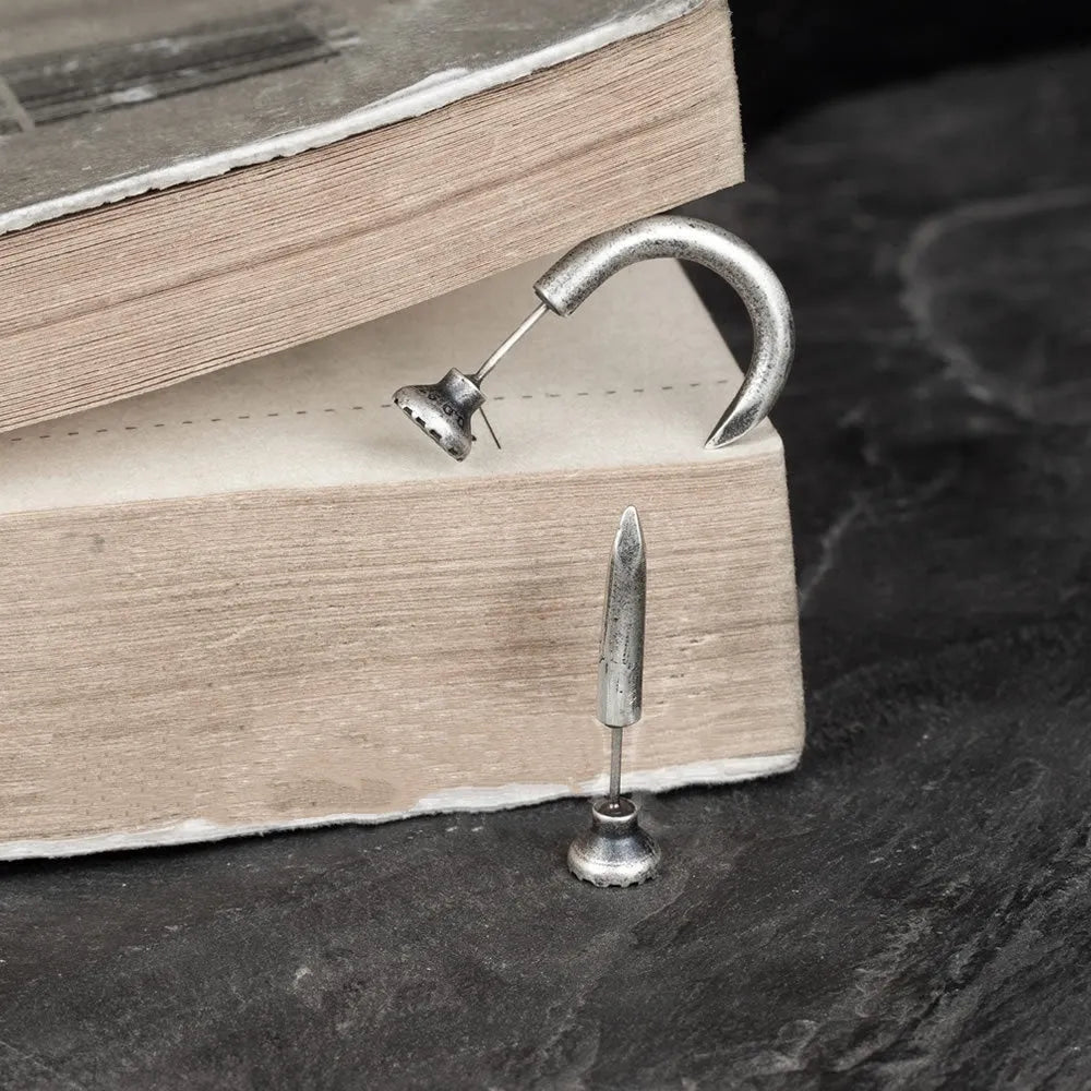 S925 sterling silver punk nail stud earrings showing straight and curved nail designs