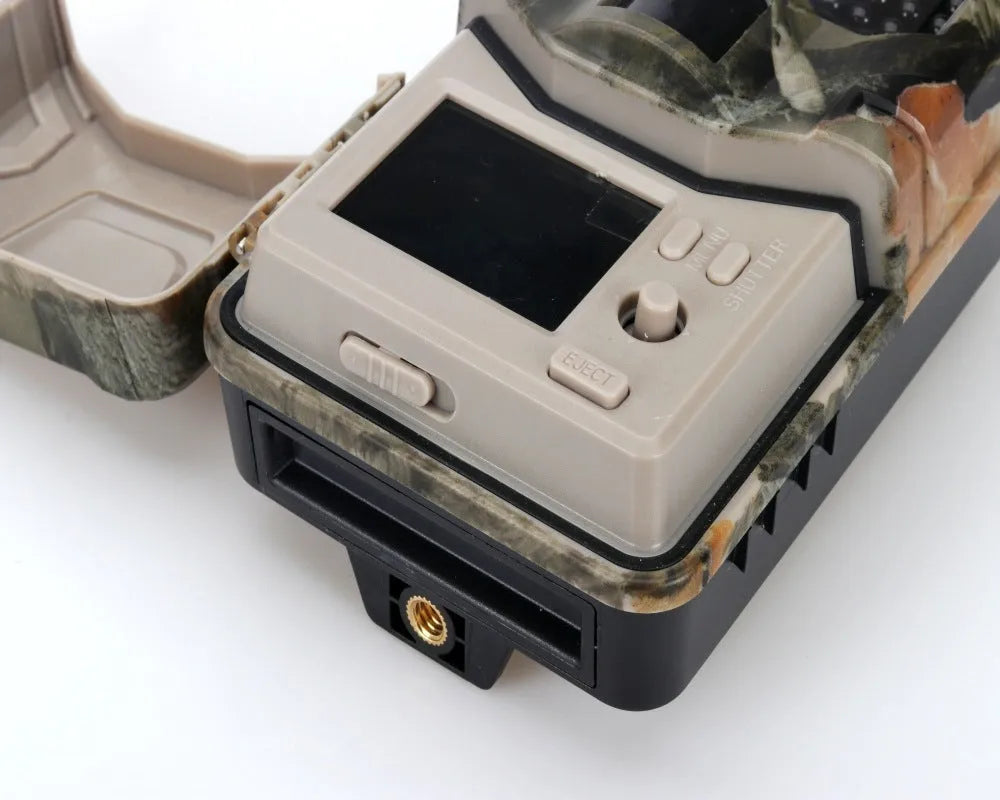 Outdoor camouflaged Bluetooth trail camera with infrared LEDs for night vision and mobile app connectivity.
