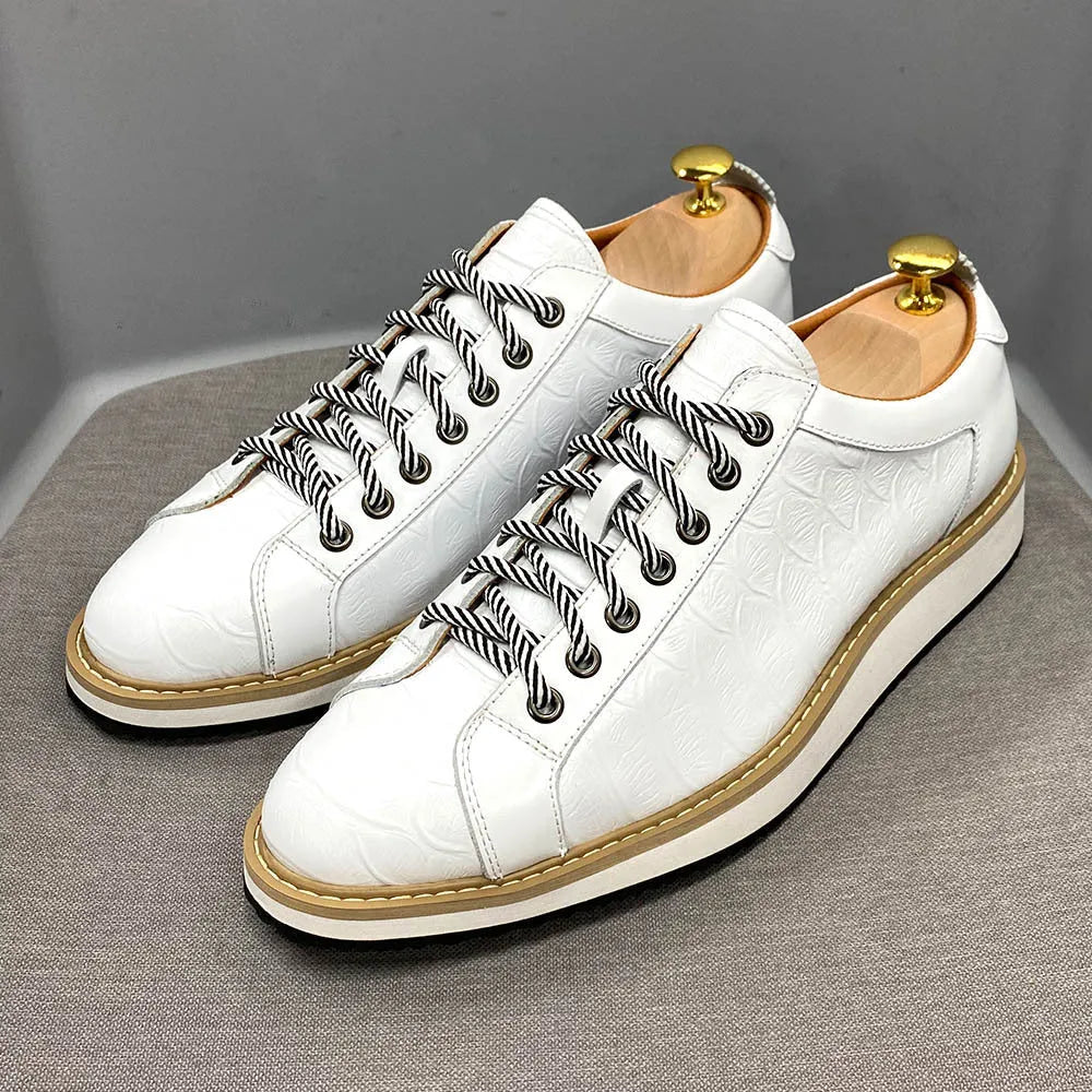 Men's low-tube shoes with an embossed pattern on the upper and a front tie lace closure.