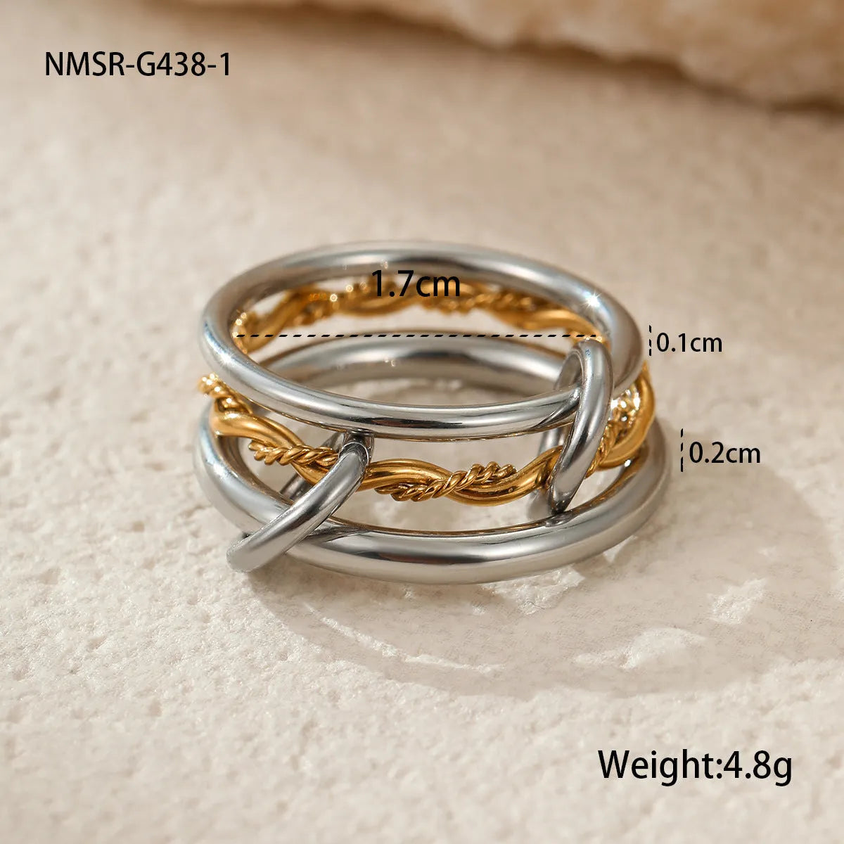 Stackable stainless steel rings with 18K gold plating in colour matching bands, exaggerated modern design