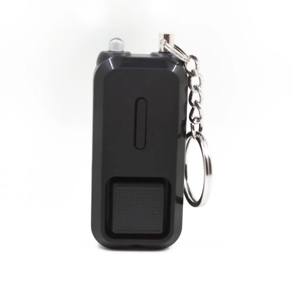 ZQ-202 personal safety alarm in pink, showing compact size next to a ruler for scale.