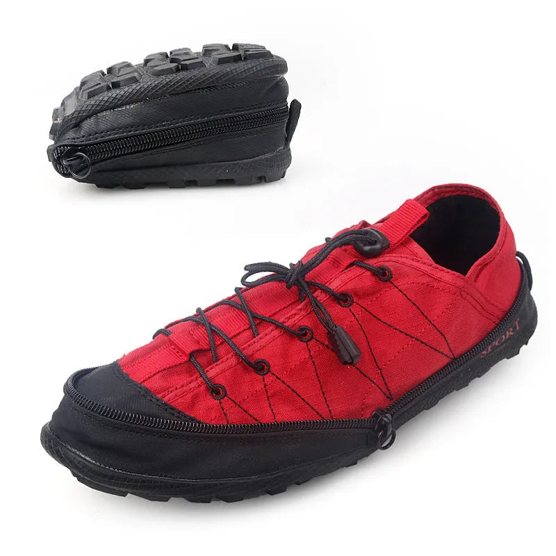 Orange portable folding outdoor shoes with a side zipper closure on a grey background
