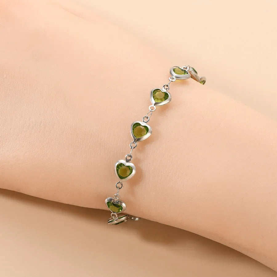 Devil's Eye Creative stainless steel geometric heart bracelet in an electroplated colour on a wrist.