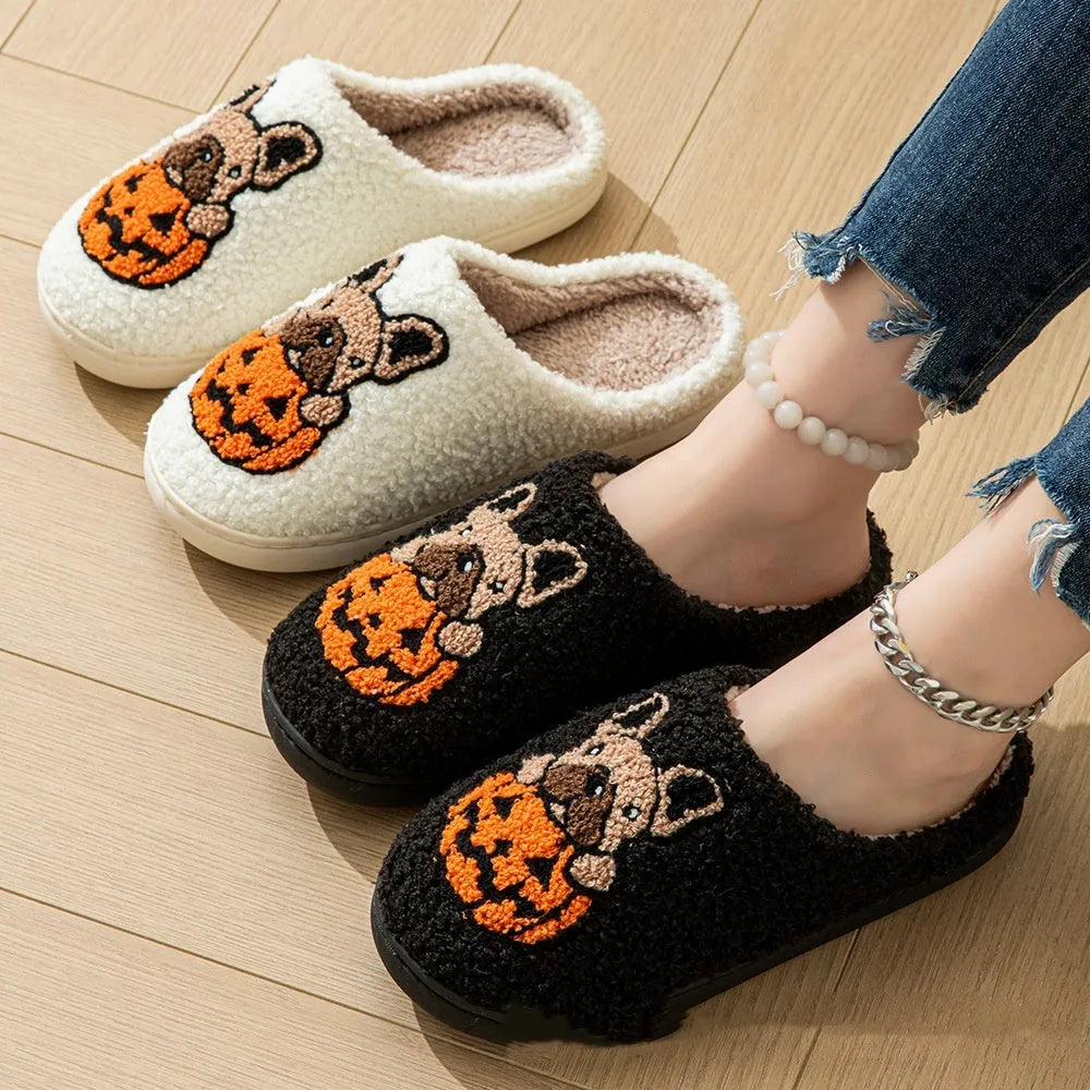 Halloween pumpkin design house slippers with plush cotton upper and TPR rubber sole in black and white.