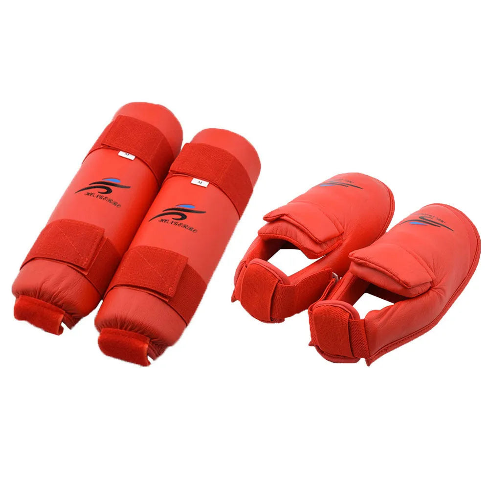 Red karate taekwondo protective gear set with leg guard, helmet and boxing gloves on white background