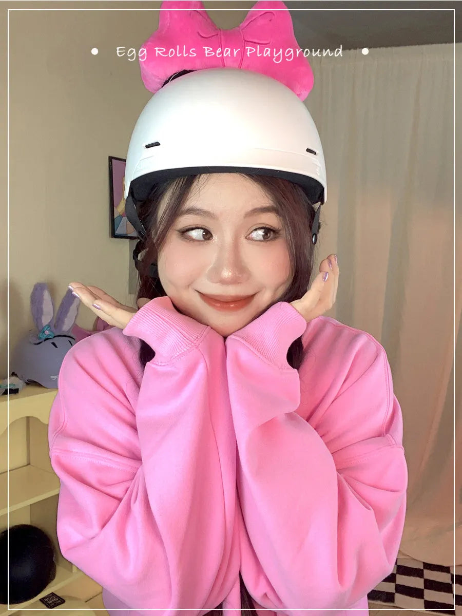 Plush bow helmet decoration in red, pink, and rose pink colours for motorcycle and ski helmets