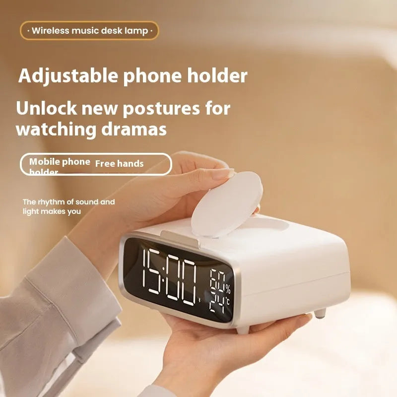 White wireless charging Bluetooth speaker alarm clock with night light on bedside table