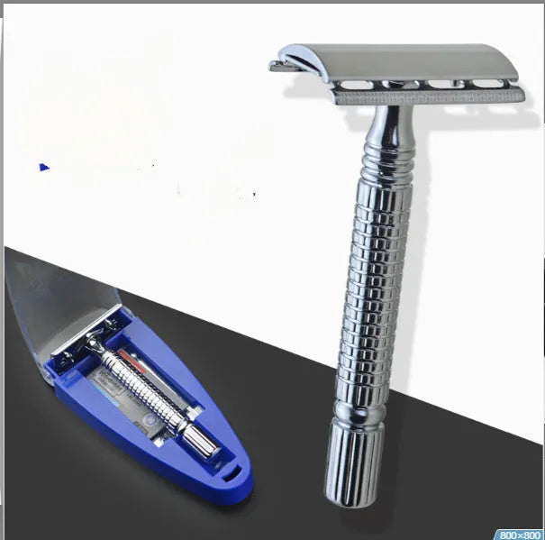Double edged safety razor with chrome-plated brass handle and closed comb head on a storage box.