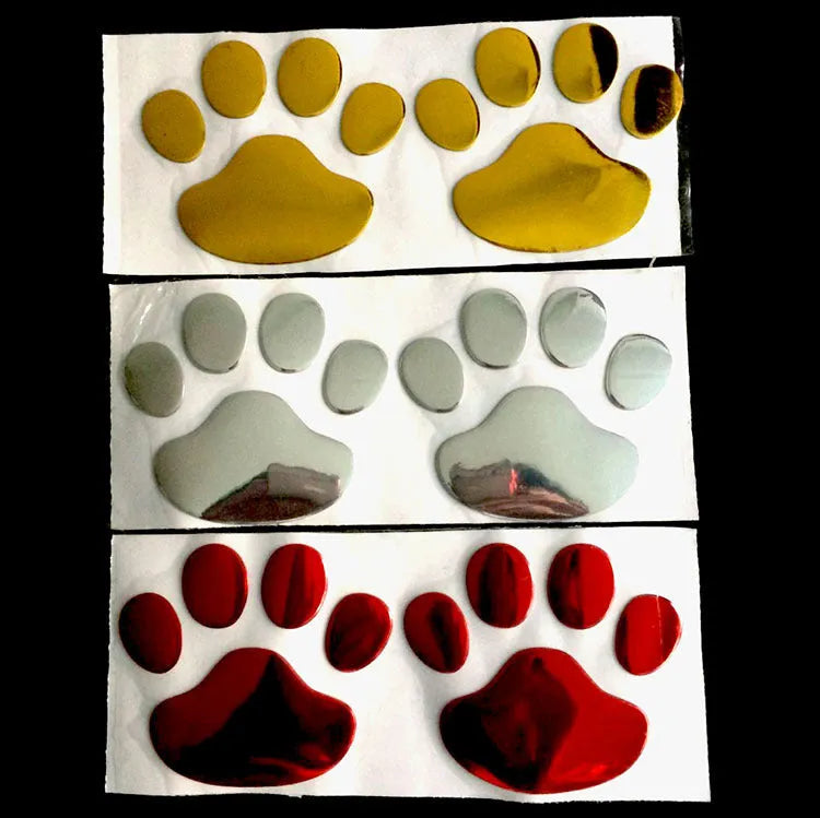 PVC hand-shaped brush dog footprint car sticker on a vehicle bumper in black colour.