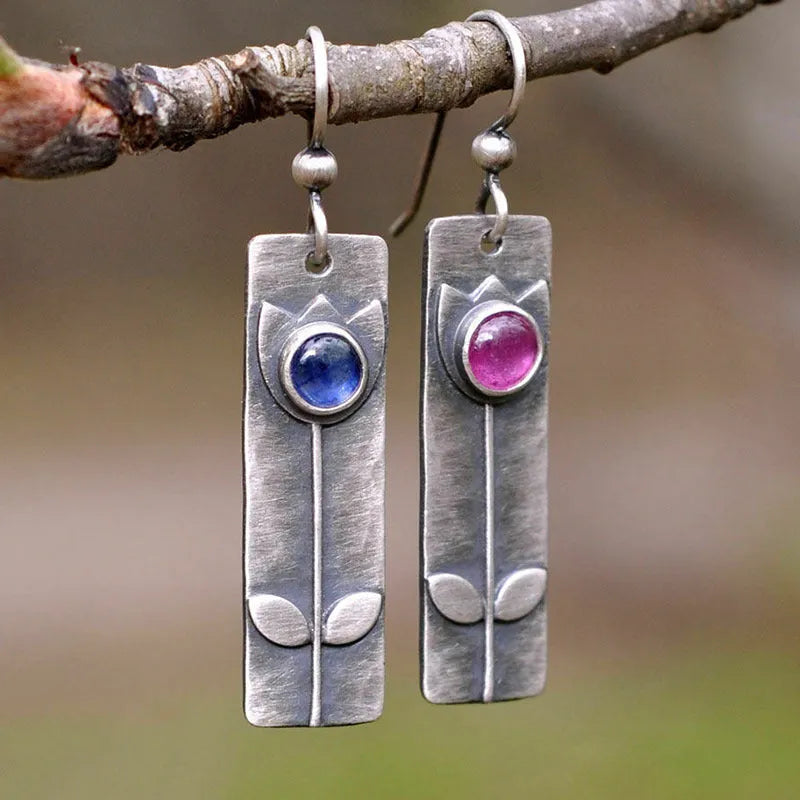 Geometric antique finish earrings with ellipse details and electroplated metal construction