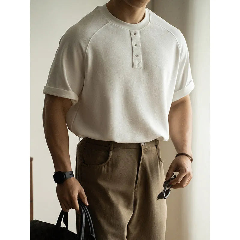Casual loose-fitting pullover top with raglan sleeves in terry texture fabric shown in smoky grey colour