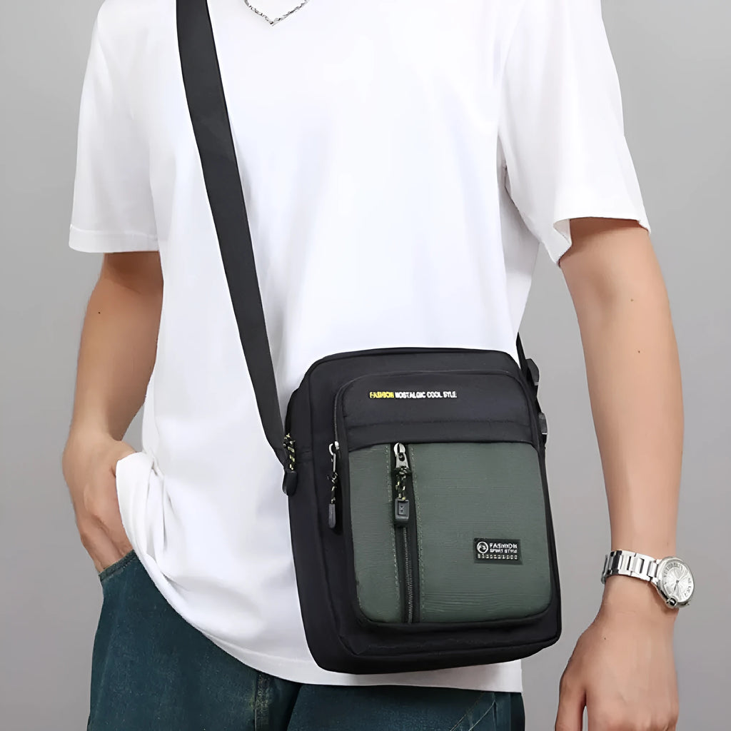 Men's nylon crossbody messenger bag in green colour showing sewing thread detailing