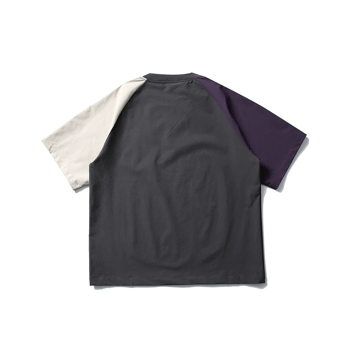 Dark grey loose fit T-shirt with contrasting colour raglan short sleeves on a hanger