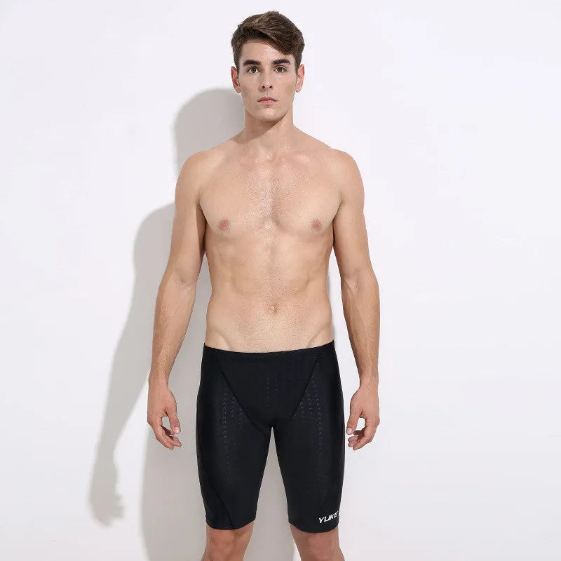 Men's black five-piece swimming set with trunks, goggles, waterproof cap, earplugs, nose clip, and carry bag.