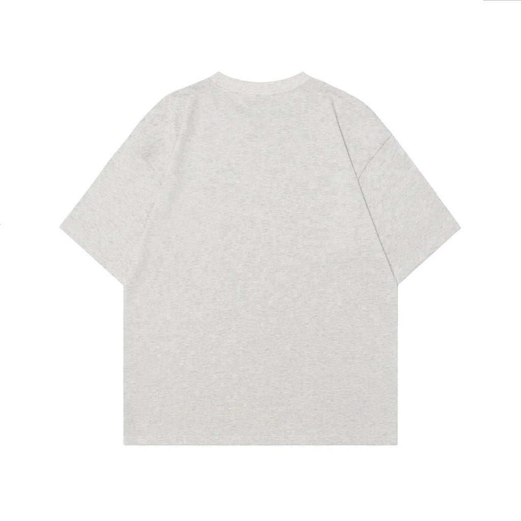 Men's black t-shirt with a retro character print, showing loose fit and short sleeves.