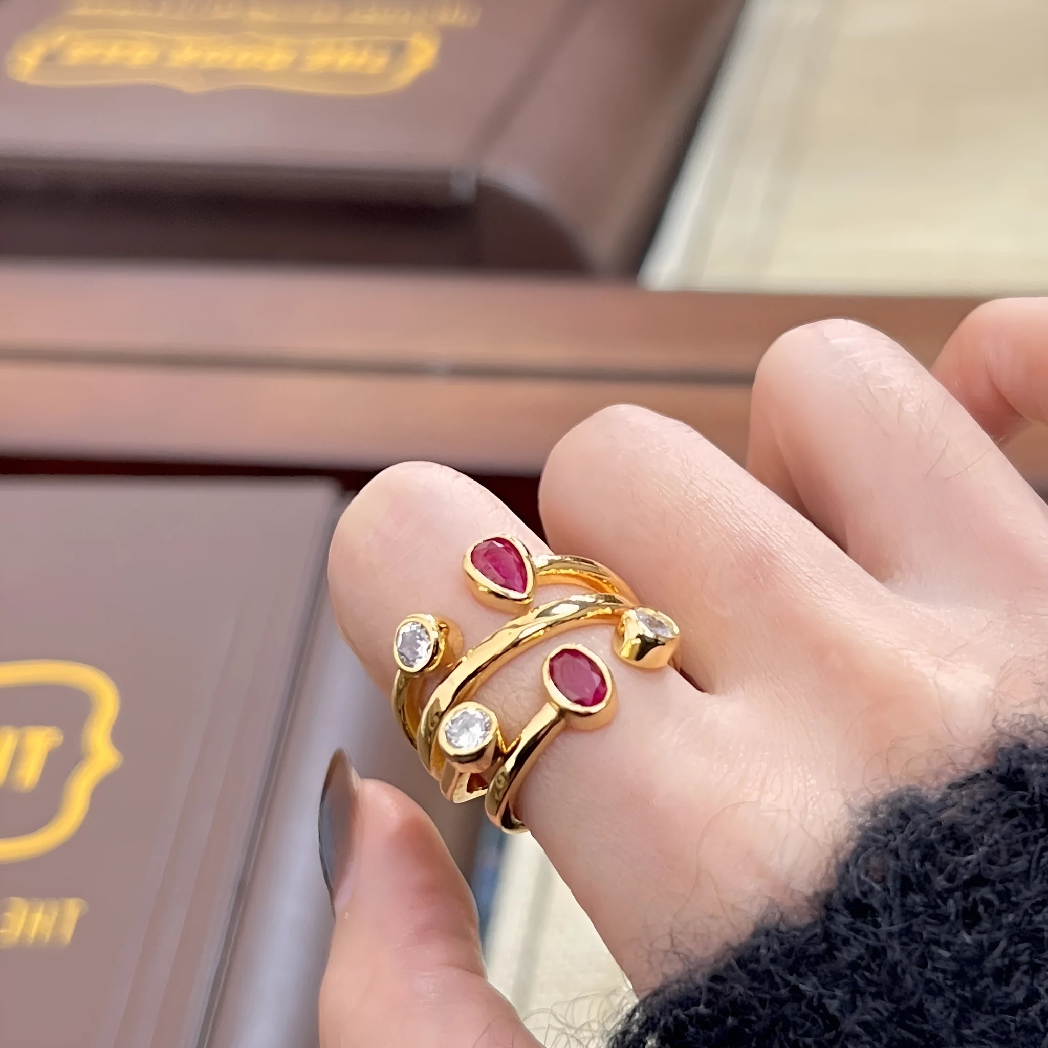 Copper geometric ring with red and white two-tone electroplated finish and group diamond setting