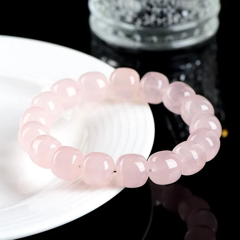 Pink natural bamboo crystal bracelet with 11x12mm barrel beads and geometry design