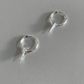 A pair of platinum-coloured geometric star-shaped clip-on earrings for women, made from electroplated copper.