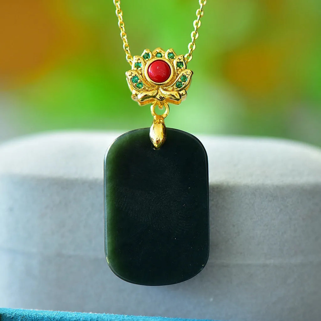 Flat, polished Hetian jade pendant in ink blue and gray, set within a handcrafted copper inlay on a necklace chain.