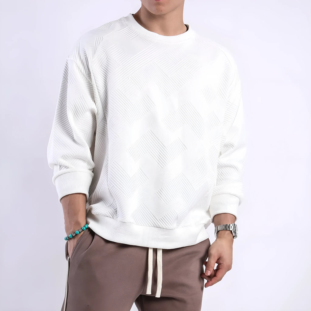 Men's loose fit long sleeve twill Jacquard sweater in solid colours on a hanger.
