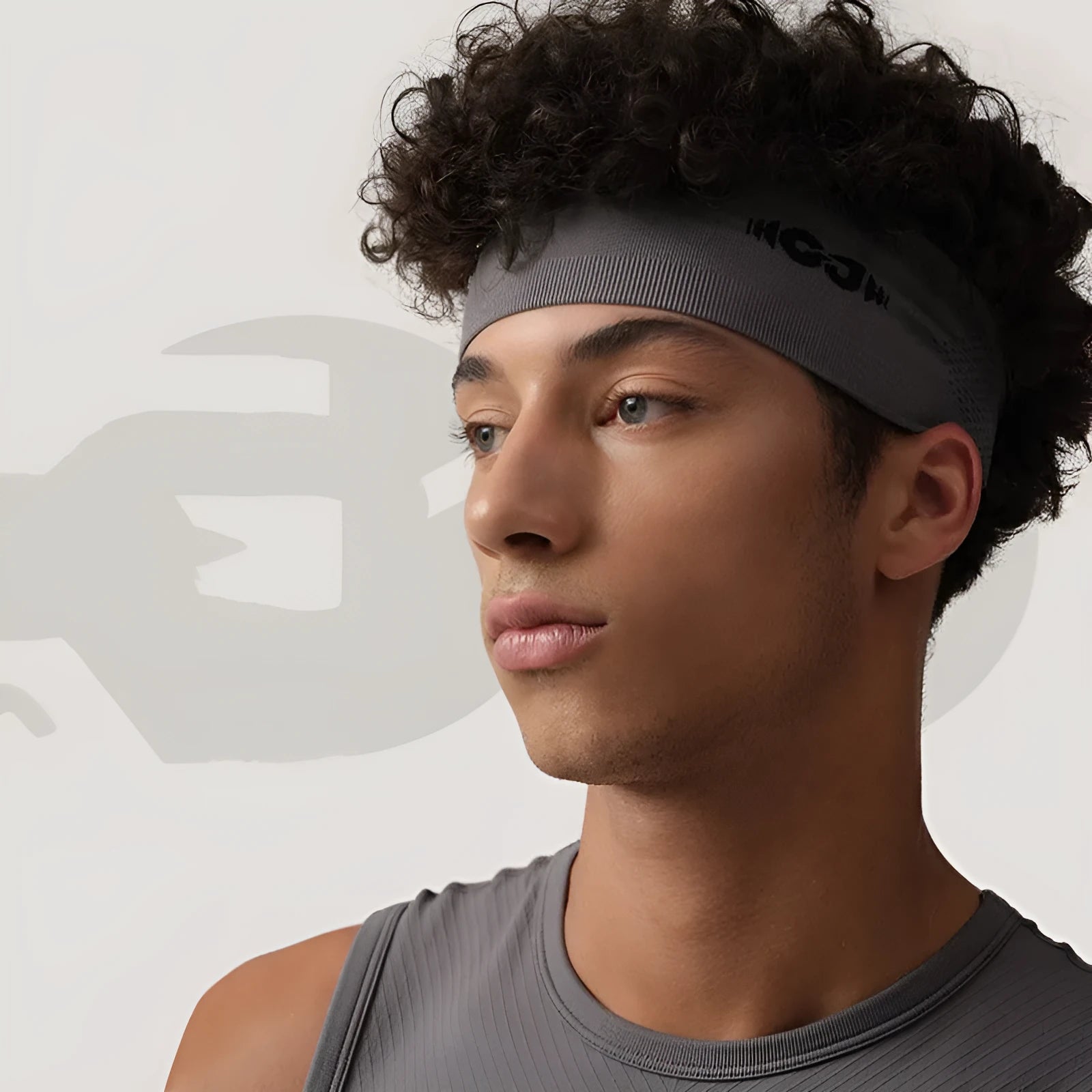 Seamless knitted sports hair band in black, grey, and blue colours for running and cycling.