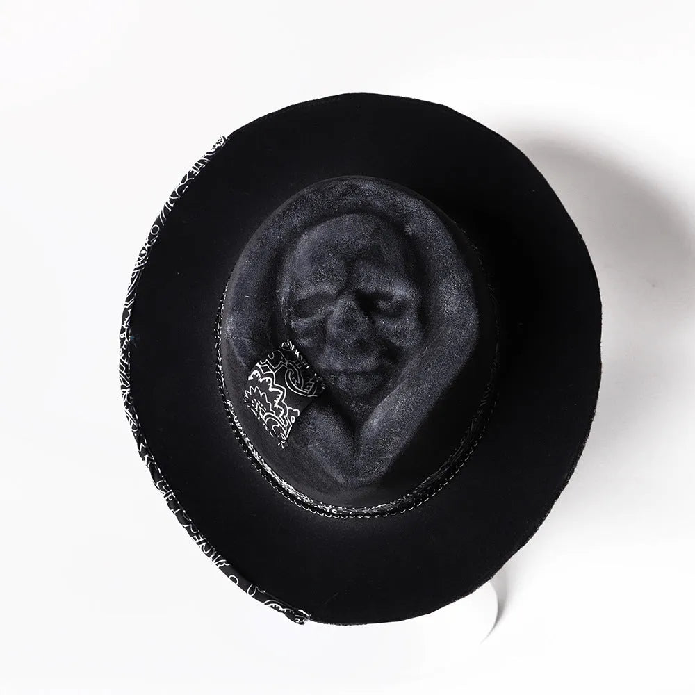 Handmade wool felt skull hat with a pointed conical crown for Halloween.