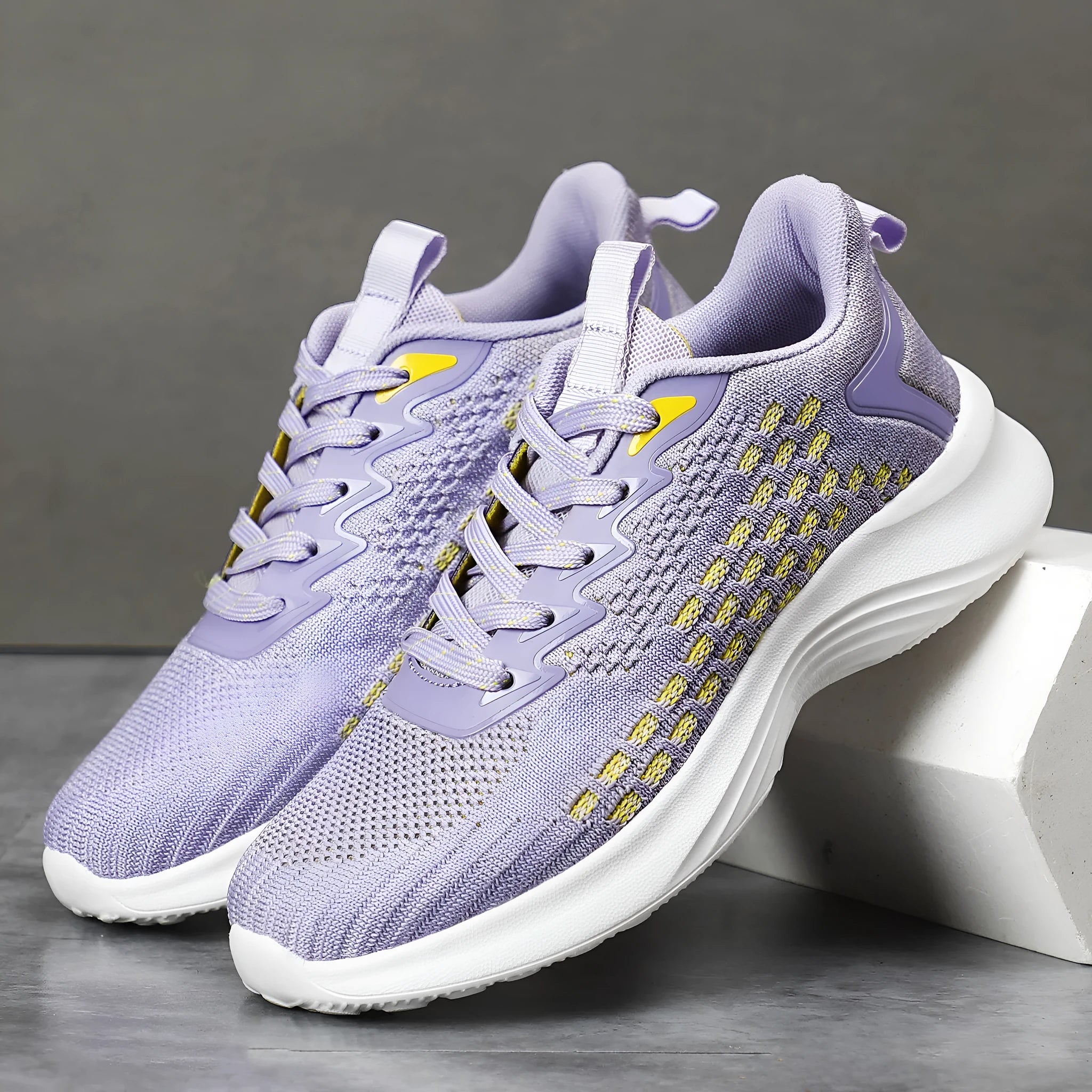 Women's Lavender Purple Flyknit running shoes with striped pattern, mesh upper, and flat EVA sole.