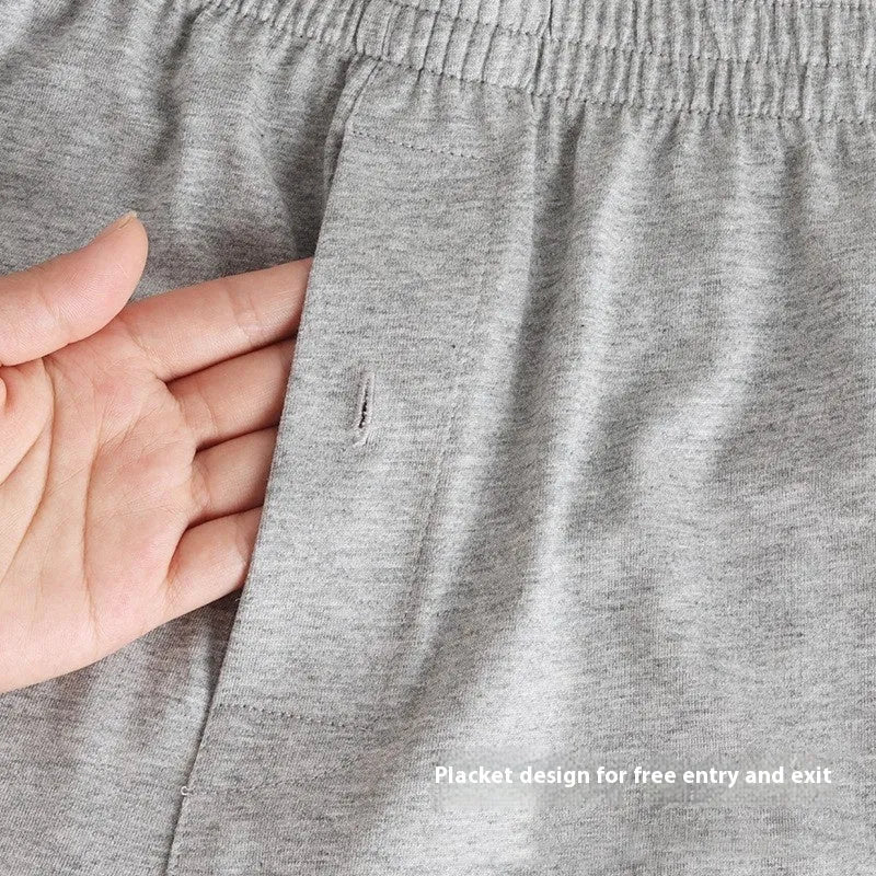 Men's black cotton loose boxer shorts with a high waist on a white background