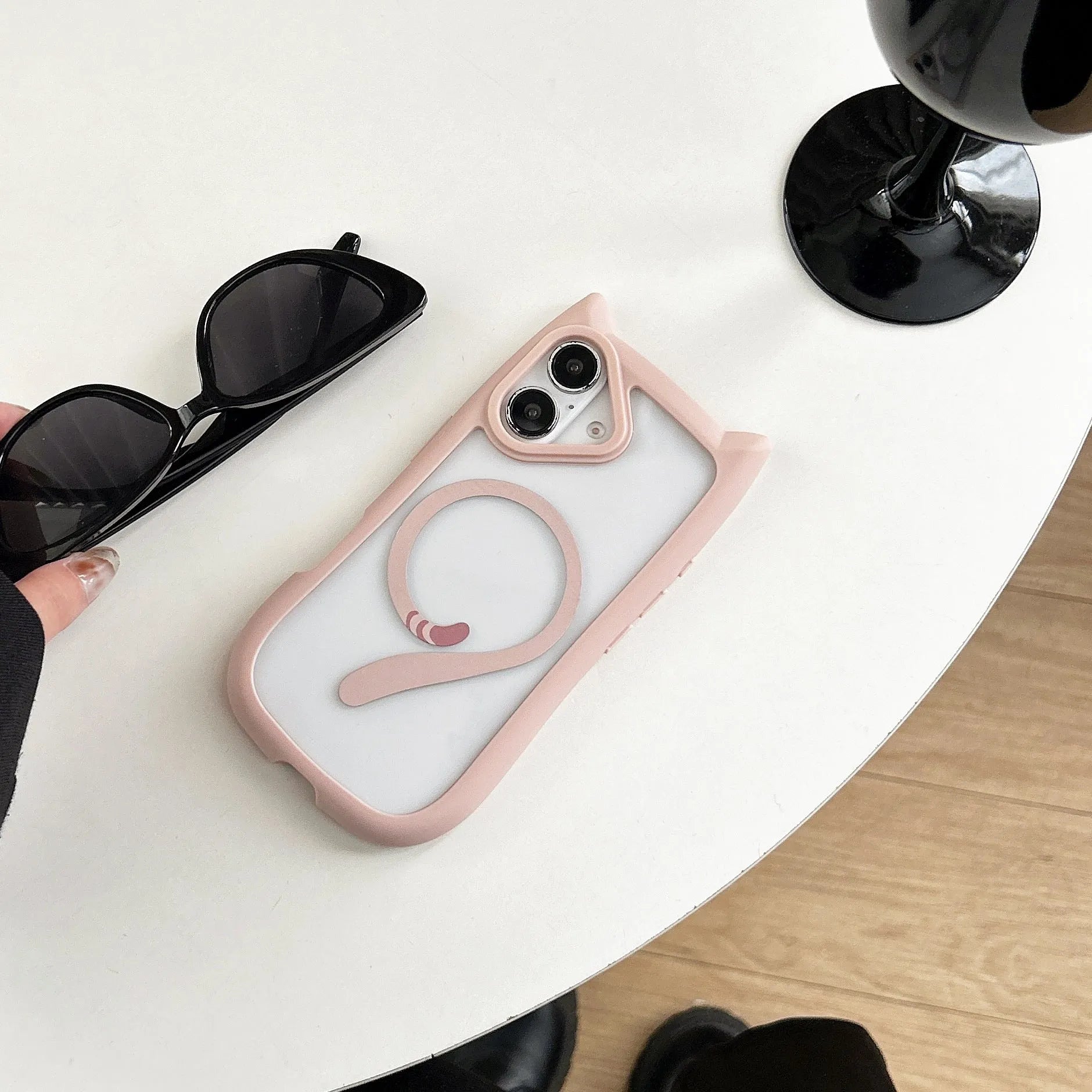 Transparent acrylic TPU phone case showing magnetic elements and wave pattern design for iPhone 17