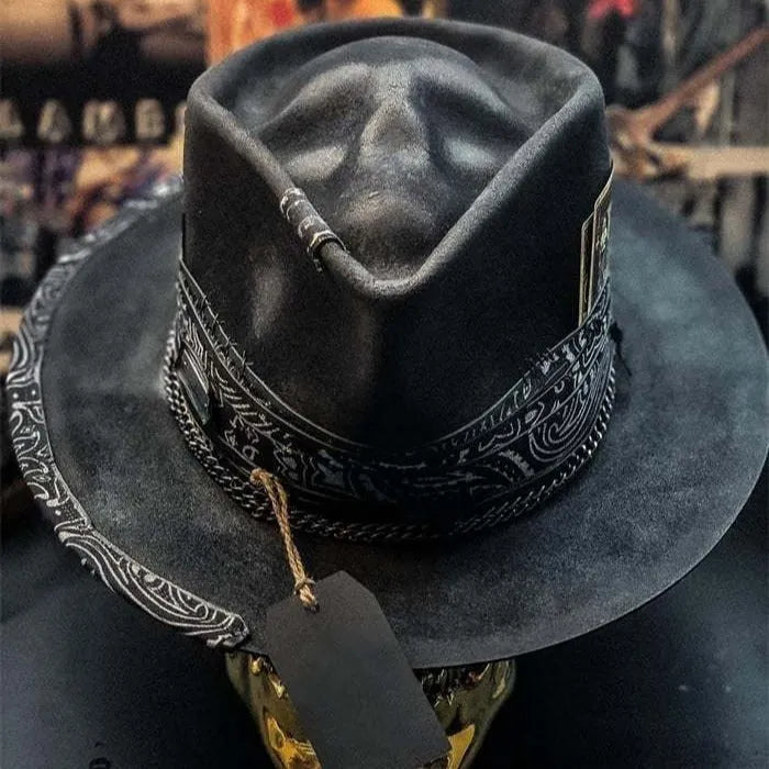 Handmade wool felt skull hat with a pointed conical crown for Halloween.